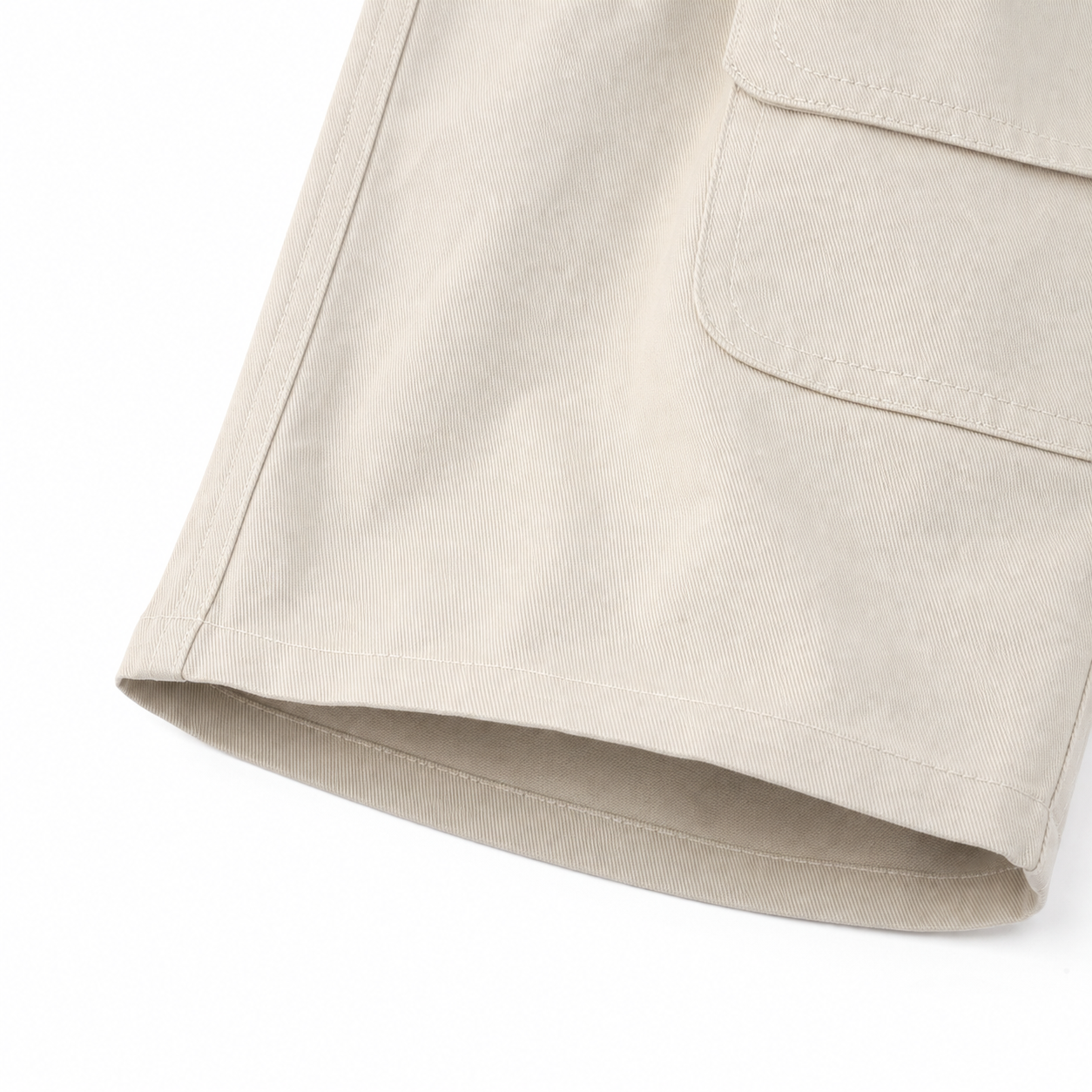 White cotton shorts hem, pocket edge and clean stitching detail