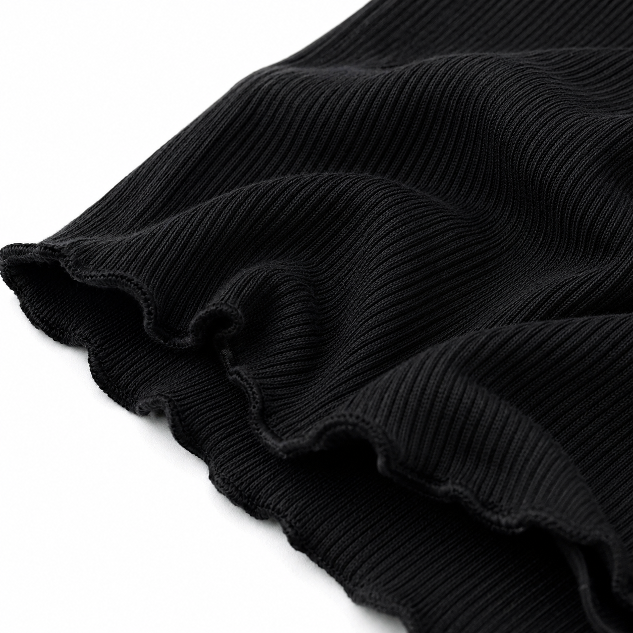 Close-up of the black ribbed fabric texture and finished edge.