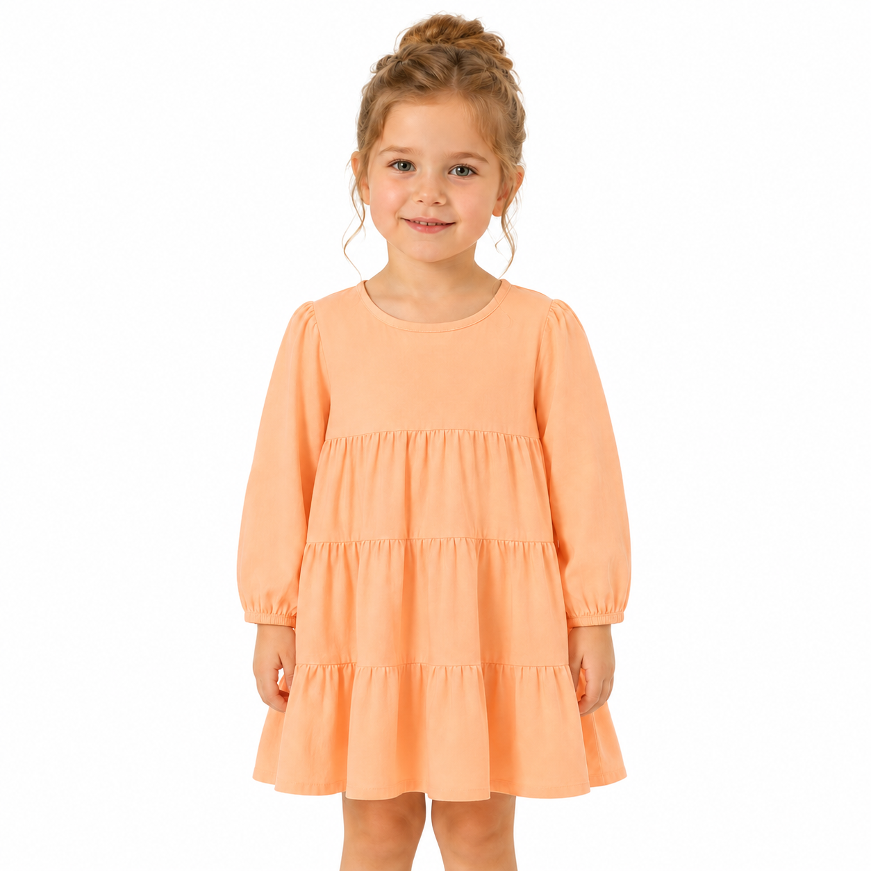 Girl model wearing the peach cotton tiered dress for everyday wear.