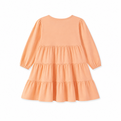 Back flat lay of the peach girls long sleeve tiered dress.