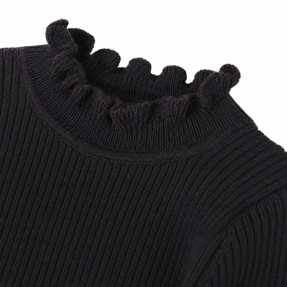 Close-up of the ruffle hem and ribbed texture on the black girls top.