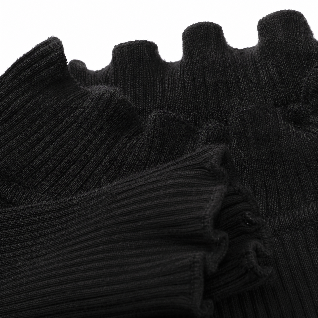 Close-up of the ribbed fabric texture on the black long sleeve girls top.