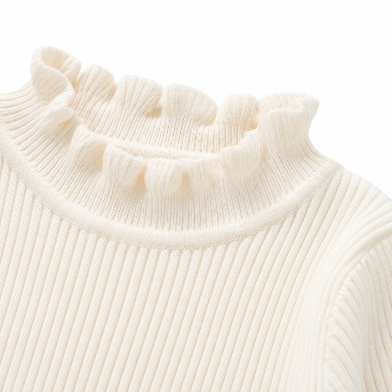 Close-up of the ruffle mock neck detail on the ivory girls long sleeve top.