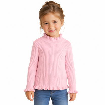 Girl model wearing the pink ribbed long sleeve top with ruffle trim.