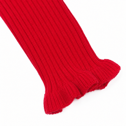 Close-up of the ruffle cuff sleeve detail on the red ribbed long sleeve top.