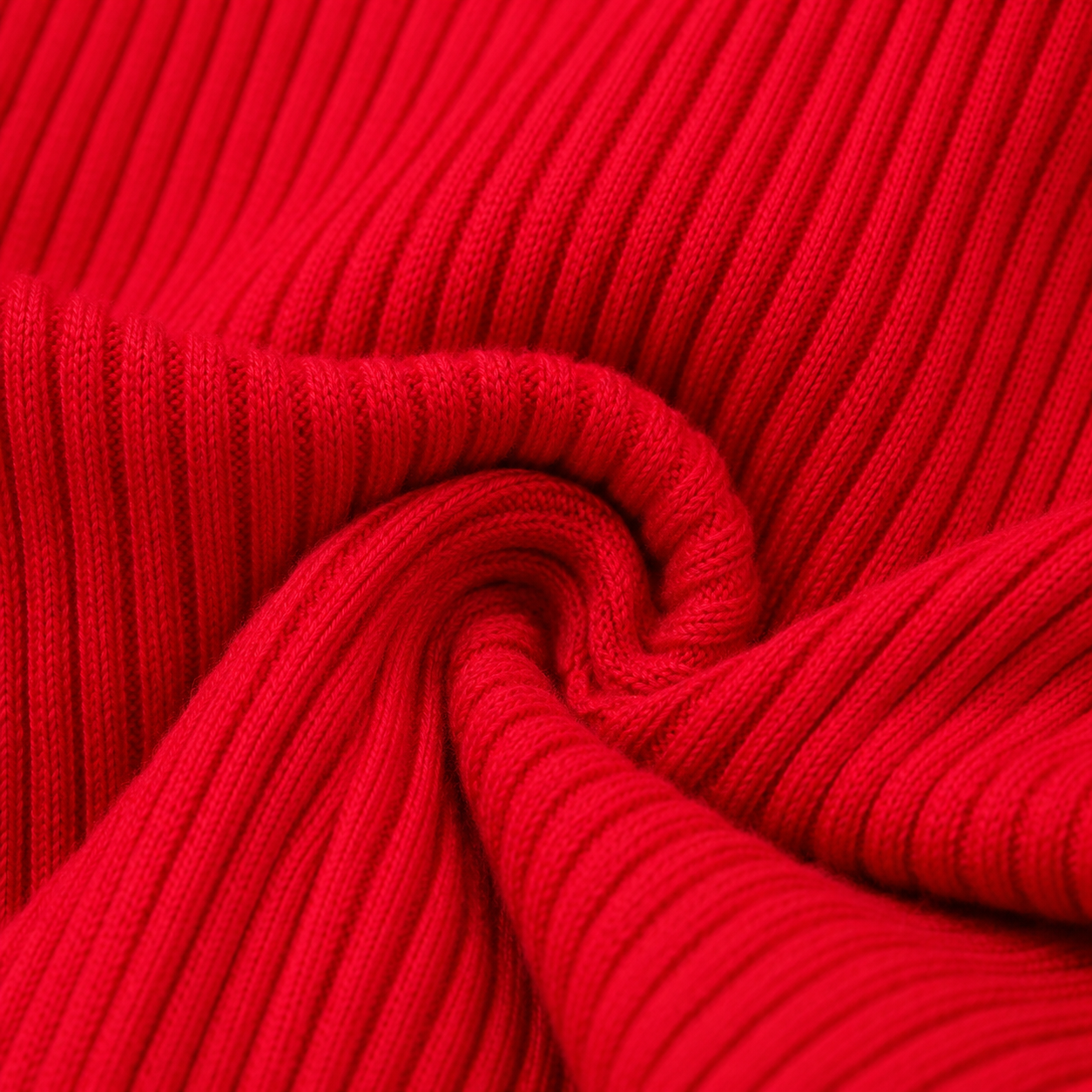 Close-up of the ribbed fabric texture on the red long sleeve girls top.